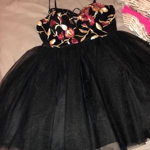 Size 5 dress with floral top and mesh detailing on the side.